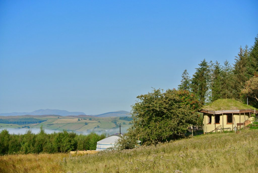 Ty Mam Mawr - Straw bale roundhouse and Yurt view to west with Arenig Fawr in sight