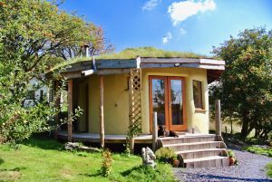 Straw bale roundhouse at intimate off grid eco retreat centre Ty Mam Mawr in North Wales